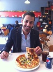 Rami enjoying a signature Bread Bar Pizza
